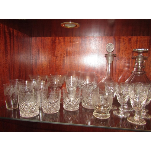 1079 - A variety of crystal glasses, two decanters and drinking glasses including tumblers, brandy balloons... 