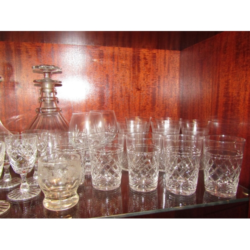 1079 - A variety of crystal glasses, two decanters and drinking glasses including tumblers, brandy balloons... 