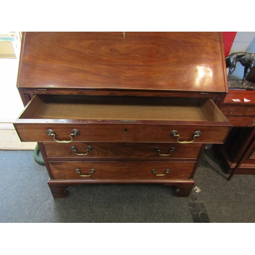 1102 - A 19th Century mahogany bureau, drop-flap with fitted interior, four graduating long drawers on brac... 