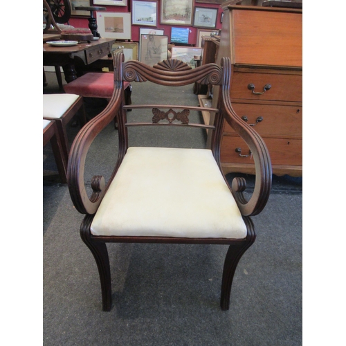 1127 - A Regency mahogany elbow chair on sabre fore legs