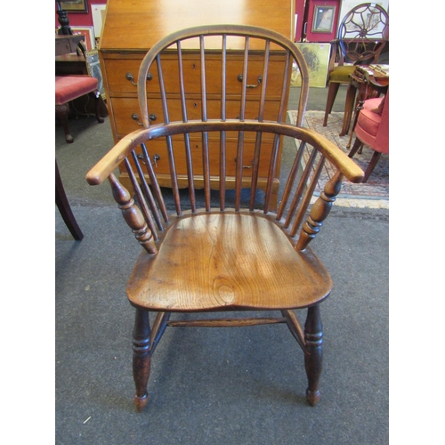 1128 - A 19th Century Windsor armchair on 'H' stretcher base