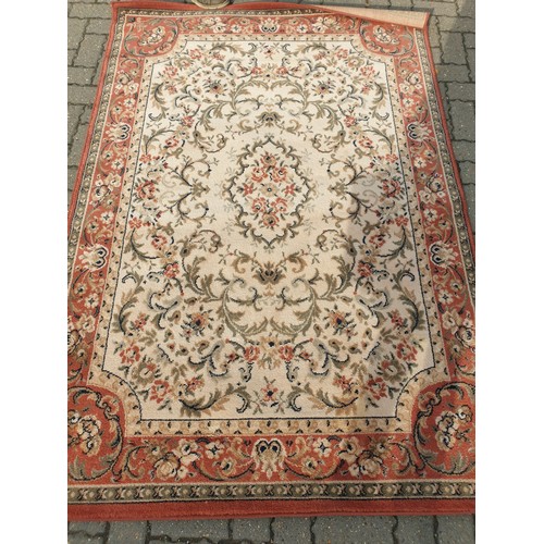 2356 - An Oriental red and cream rug 195 x 135cm