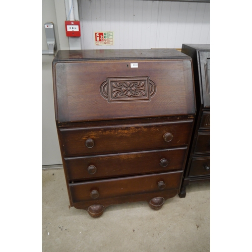 2385 - A 1960's oak bureau and an oak three drawer bureau