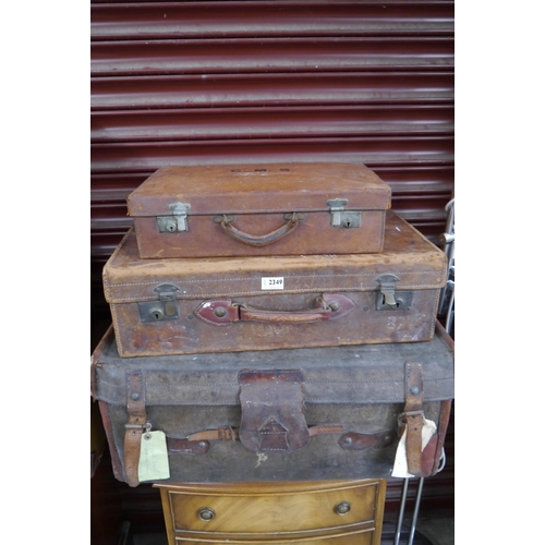 2423 - Three leather cases, two stamped 