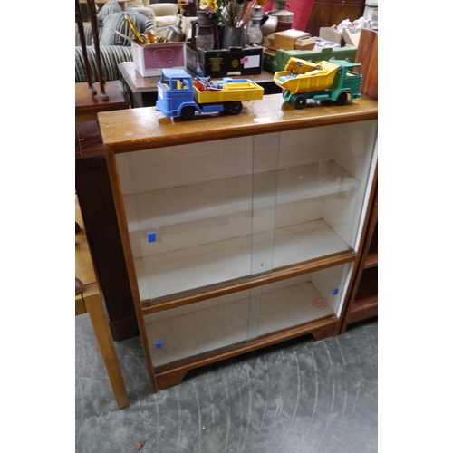 2413 - A mid Century oak glazed cabinet