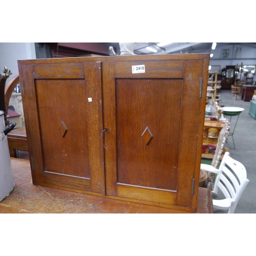 2331 - An oak two door wall cupboard