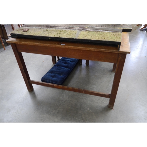 2053 - An Edwardian solid oak school desk , with central partition grove to centre, under slats missing