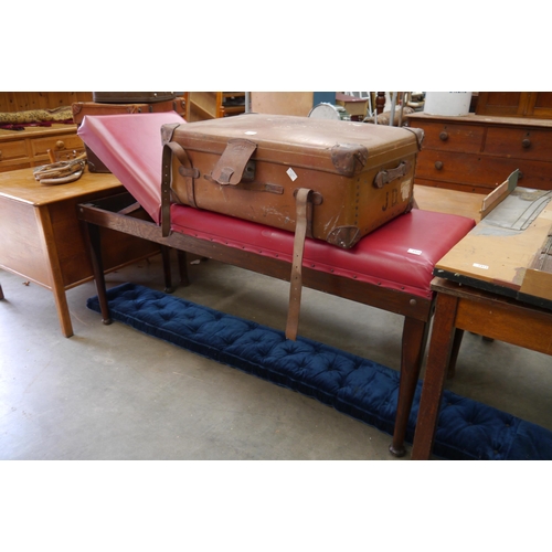 2359 - A 1920's red leatherette oak examinations chair by the surgical manufacturing company