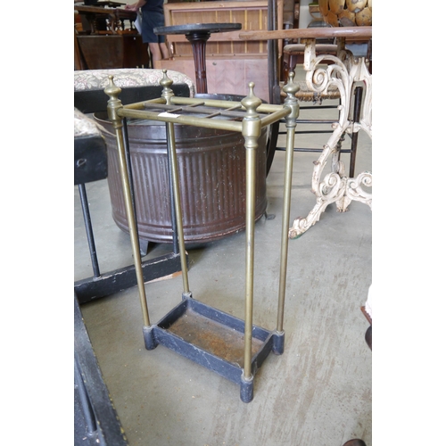 2002 - A Regency brass and cast iron stick stand