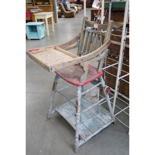 2017 - A 1920's American oak metamorphic child's high chair with worn paint finish