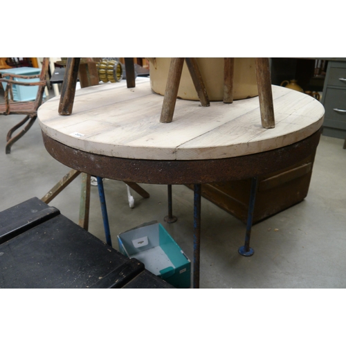 2034 - An industrial circular pine top table with cast iron base