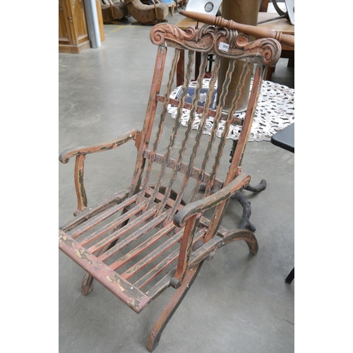 2043 - A 19th American folding chair with distressed paint work