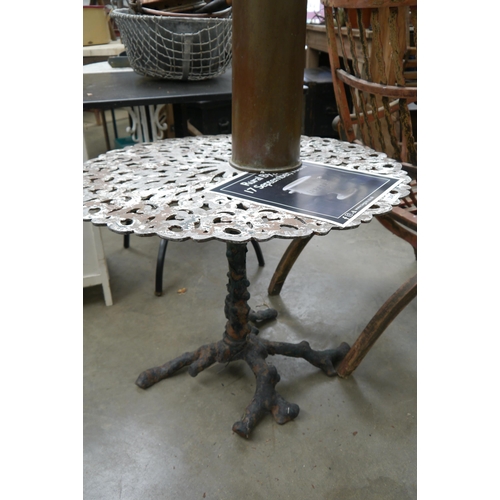 2045 - A cast iron arboreal based garden table