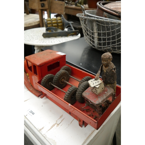 2047 - A tin plate toy truck and figure