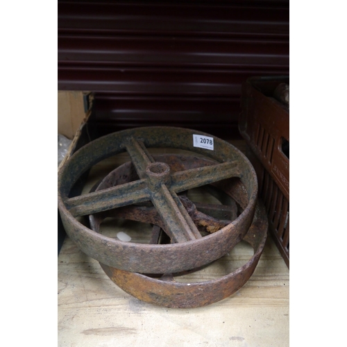 2078 - Three cast iron cart wheels