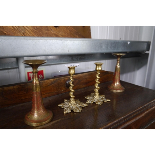 2112 - Two Indian brass candlesticks and two brass barley twist candlesticks