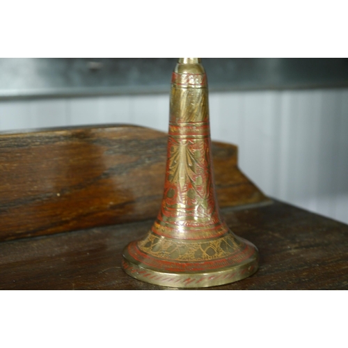 2112 - Two Indian brass candlesticks and two brass barley twist candlesticks