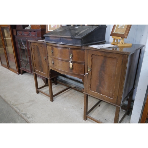 2143 - A 1940's mahogany sideboard with bow front