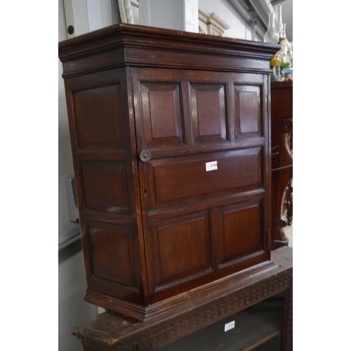 2166 - A Georgian panelled mahogany corner unit