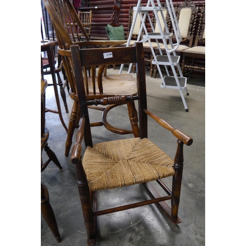 2190 - A 19th century oak childs rocking chair with seagrass seat