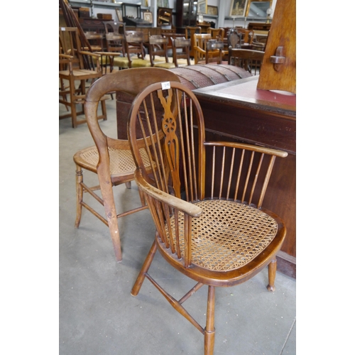 2195 - A rattan wheelback windsor and a rattan ballon back chair