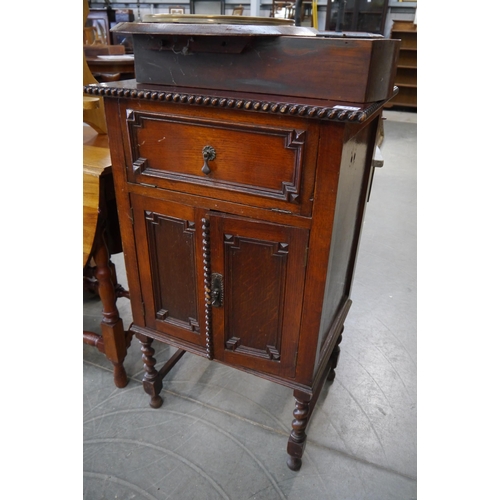 2212 - A 1930's oak record cabinet