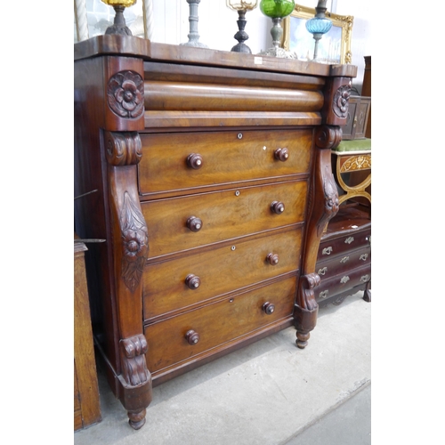 2216 - A substantial 19th Century mahogany Scotch chest of five drawers with carved sides