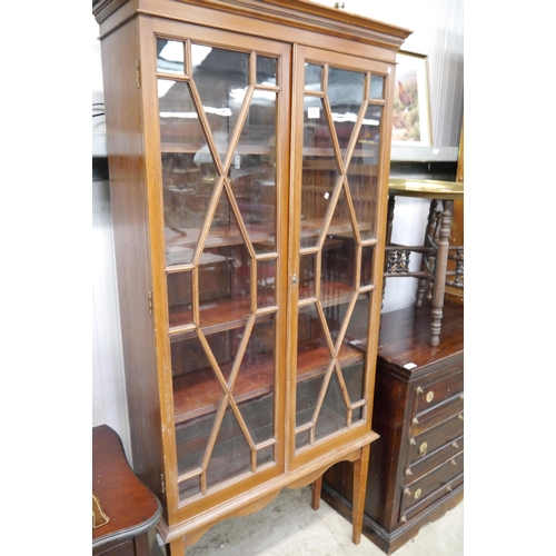 2222 - An Edwardian mahogany astragal glazed cabinet on legs