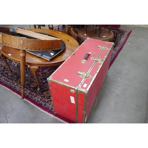 2249 - A red travelling trunk