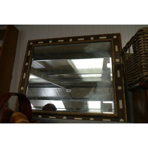 2280 - A wall mirror with decorative frame