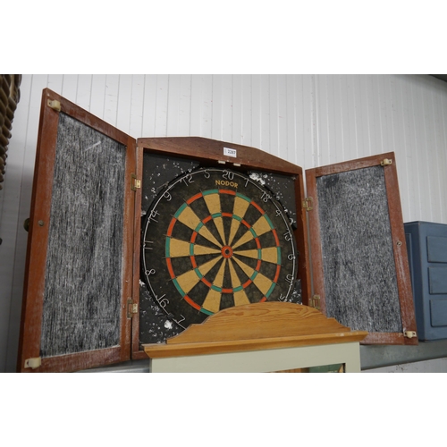 2287 - A mahogany cased dart-board