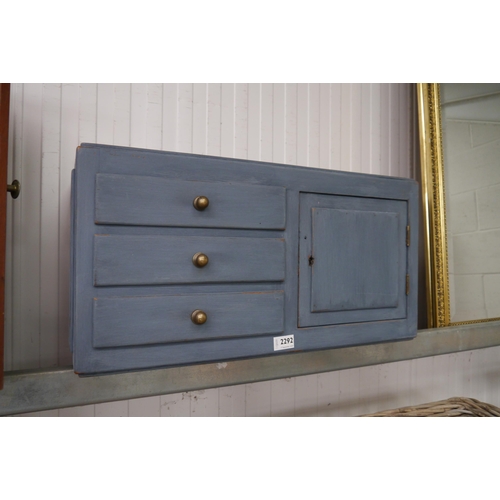 2292 - A blue painted wall hanging cabinet of three drawers to one door