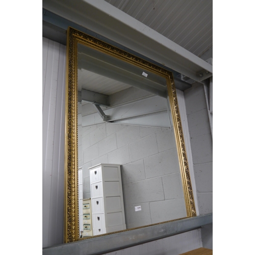 2293 - A modern gilt framed wall mirror, bevelled glass