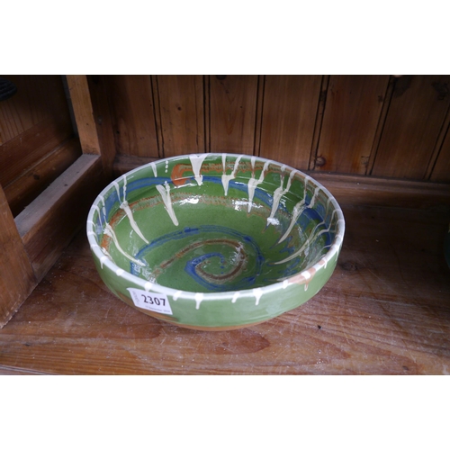 2307 - A green glazed pottery bowl