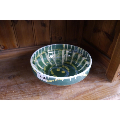 2308 - A green glazed pottery bowl