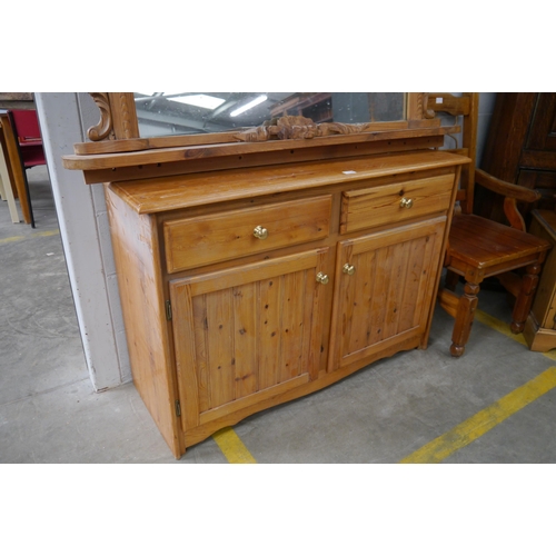 2328 - A pine two drawer, two door sideboard