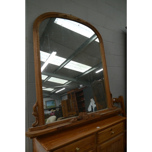 2329 - A Victorian style pine overmantel mirror with carved crest