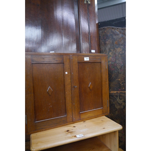 2331 - An oak two door wall cupboard