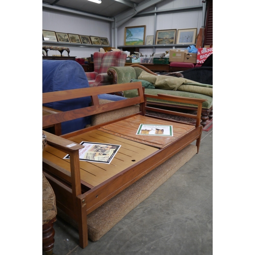 2352 - A mid 20th Century teak two seater sofa, with drop arms to both ends