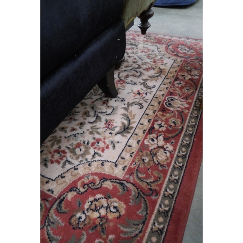 2356 - An Oriental red and cream rug 195 x 135cm