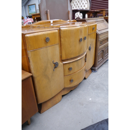 2408 - A 1940's walnut cocktail cabinet sideboard with fiolled interior