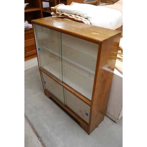 2413 - A mid Century oak glazed cabinet