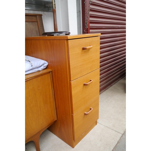 2444 - A teak three drawer filing cabinet and files