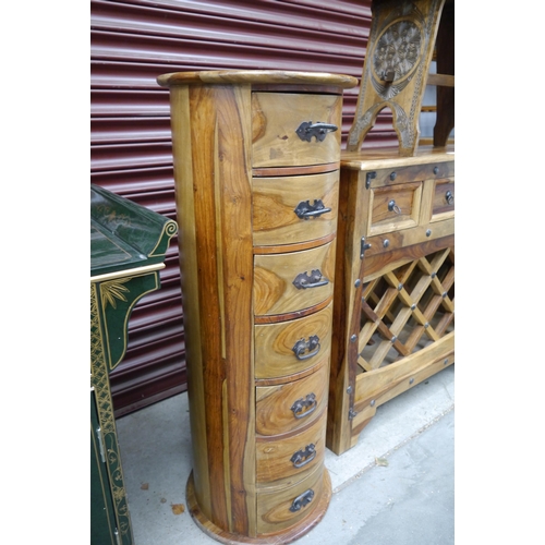 2448 - A cylindrical mango wood chest of 7 drawers