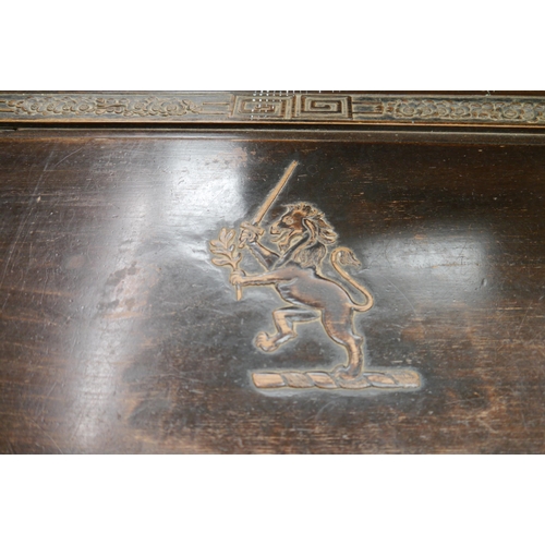 2462 - A 1920's camphor wood blanker box with lion and sword top