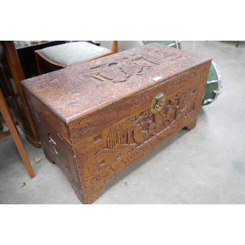 2463 - A 1930's heavily carved camphor wood blanket box