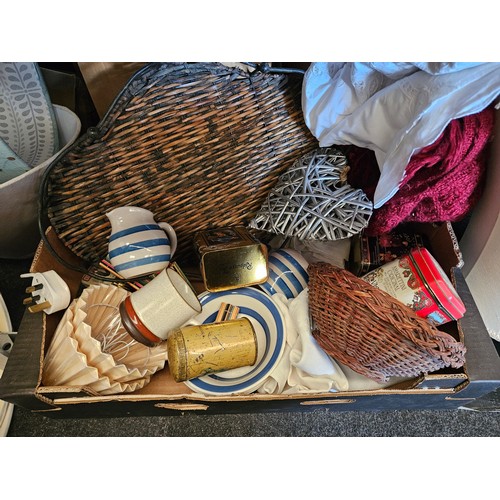 1624 - A box containing lamp shades, lace, throw, place mats, coasters, ceramics, tins etc.