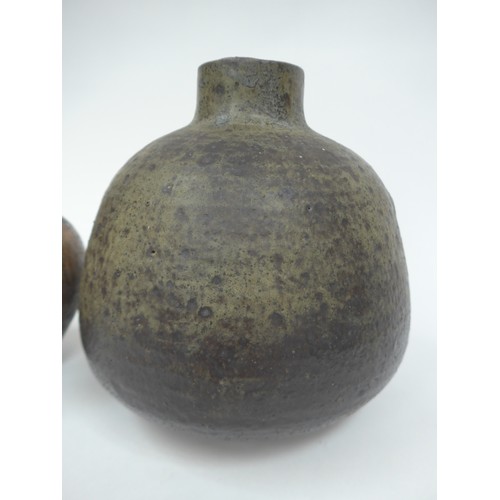 7061 - Two studio pottery vases, largest example with mottled green/grey glaze, incised R.S to base, 21cm h... 