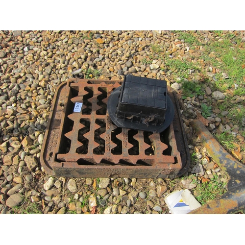 3243 - A cast iron drain cover etc