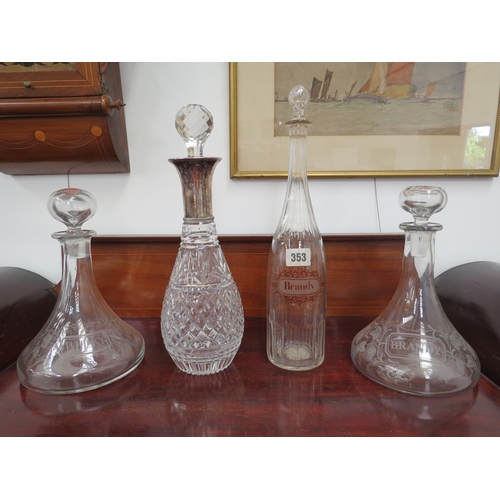 6108 - A pair of ships decanters etched with fruiting vines, 'Whisky' and 'Brandy' and two others (4)